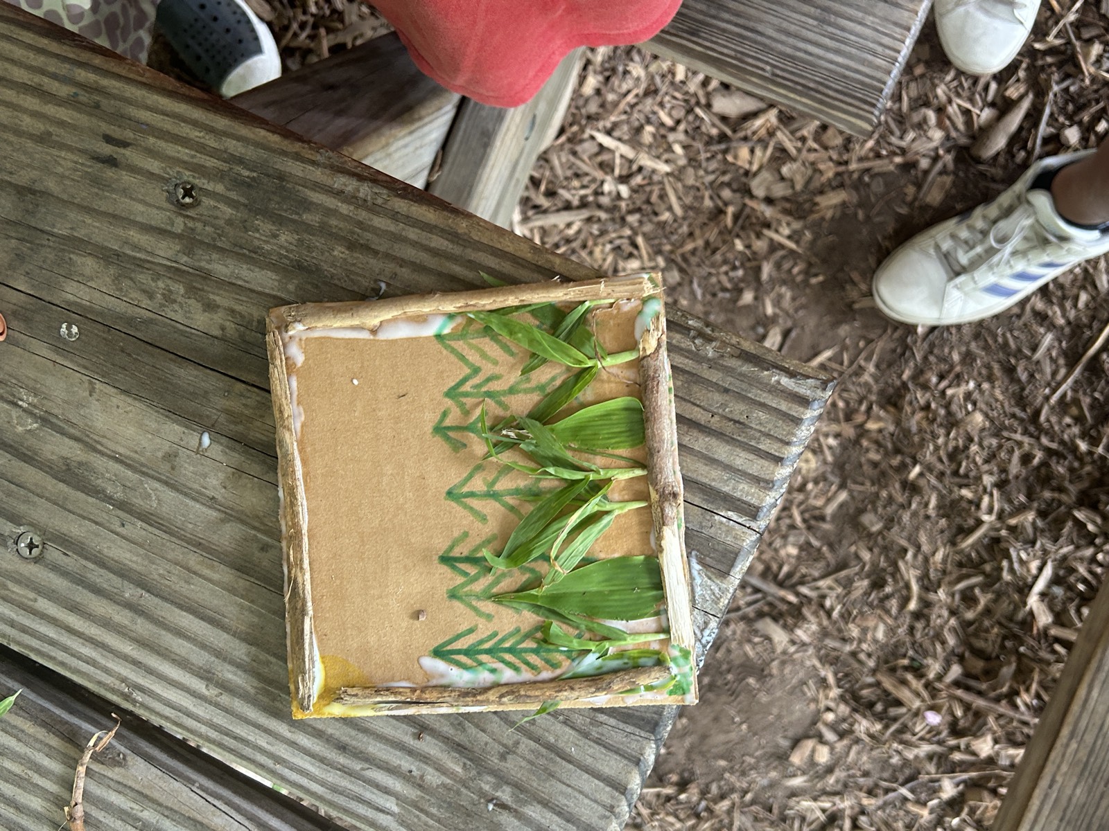 A camper working on a hands-on nature activity